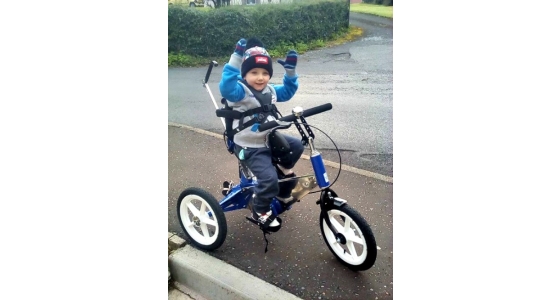 Charlie is delighted with his new Tomcat Tiger Trike