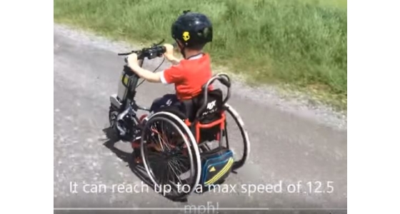 Childrens wheelchair power attachment