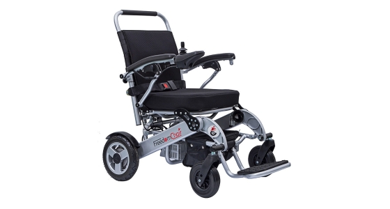 Folding electric wheelchair with attendant controls