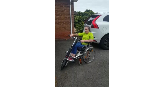 Happy customer Taryn takes delivery of the Firefly wheelchair power attachment